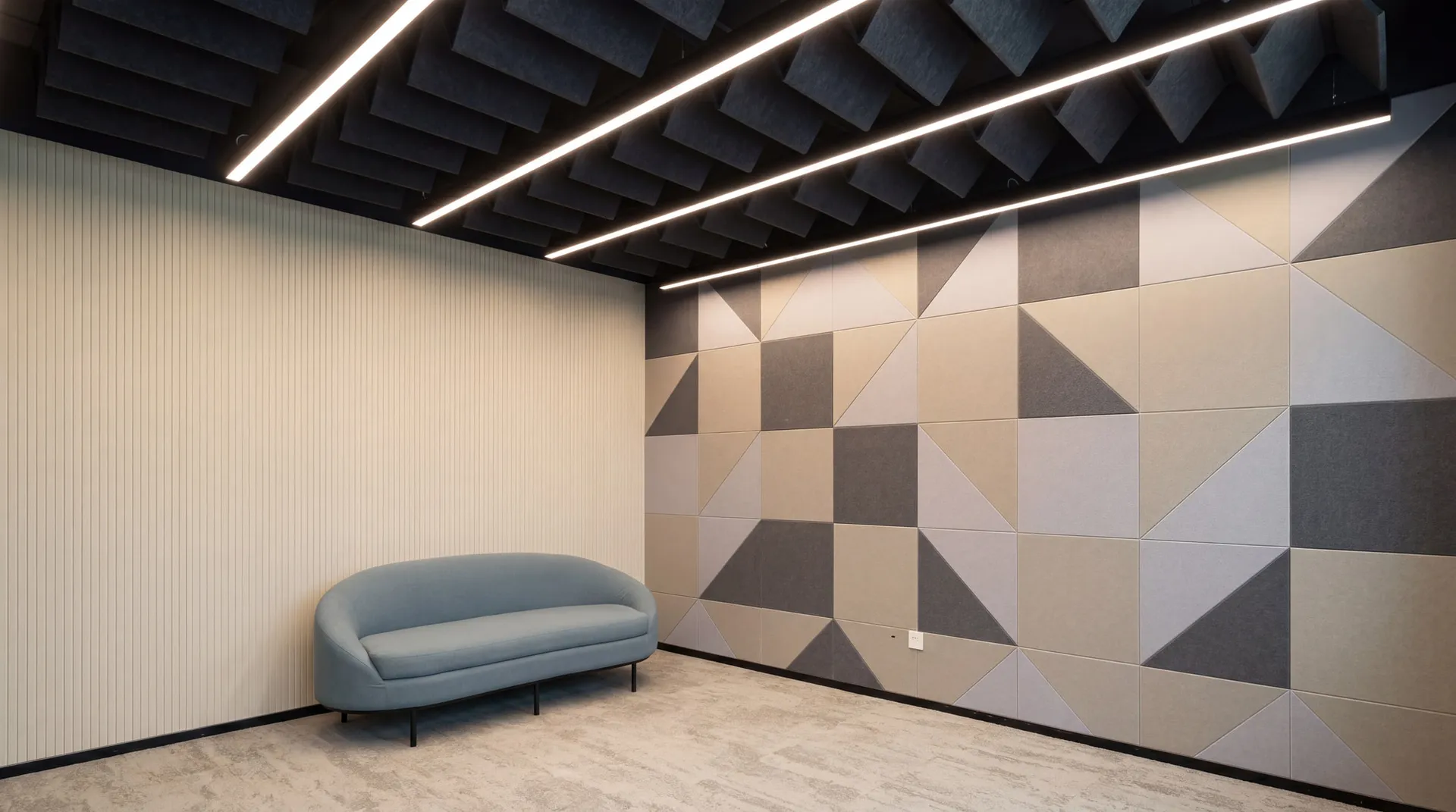 Baffle ceiling continuing onto wall