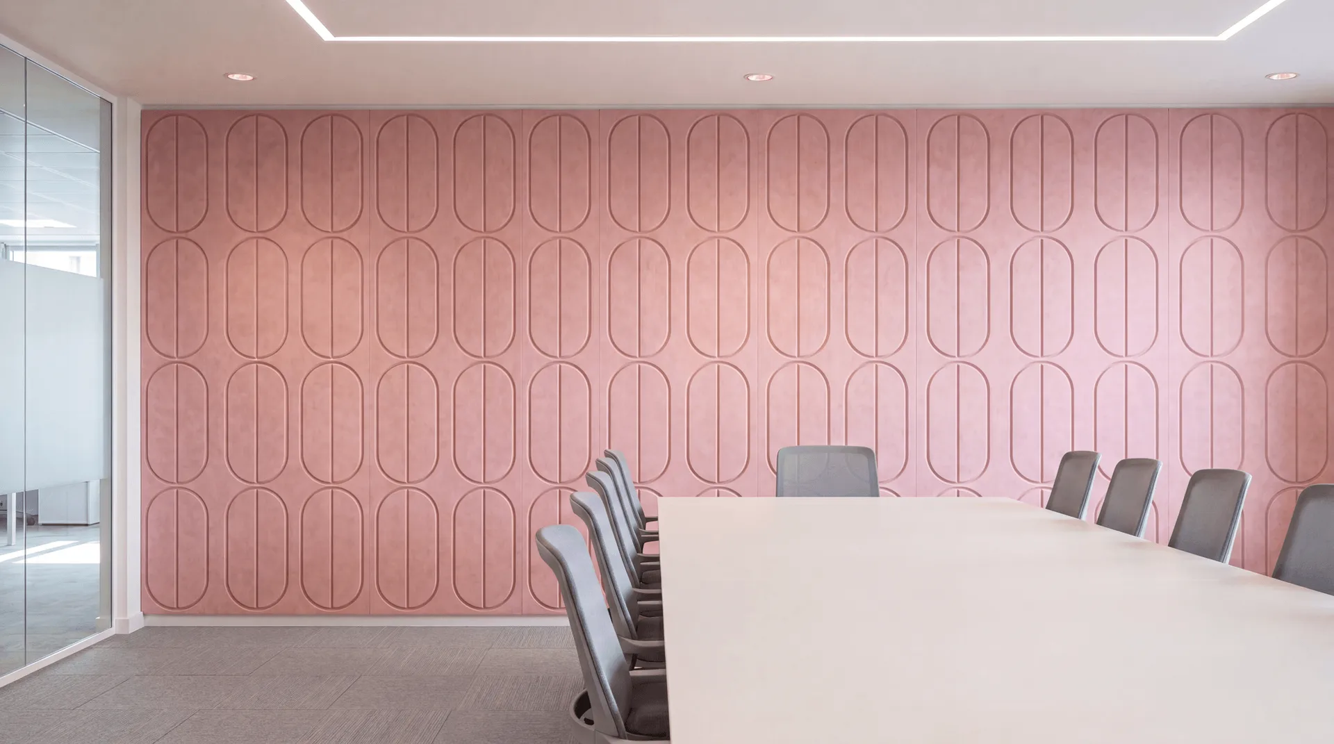 Pink capsule meeting room with grooved walls