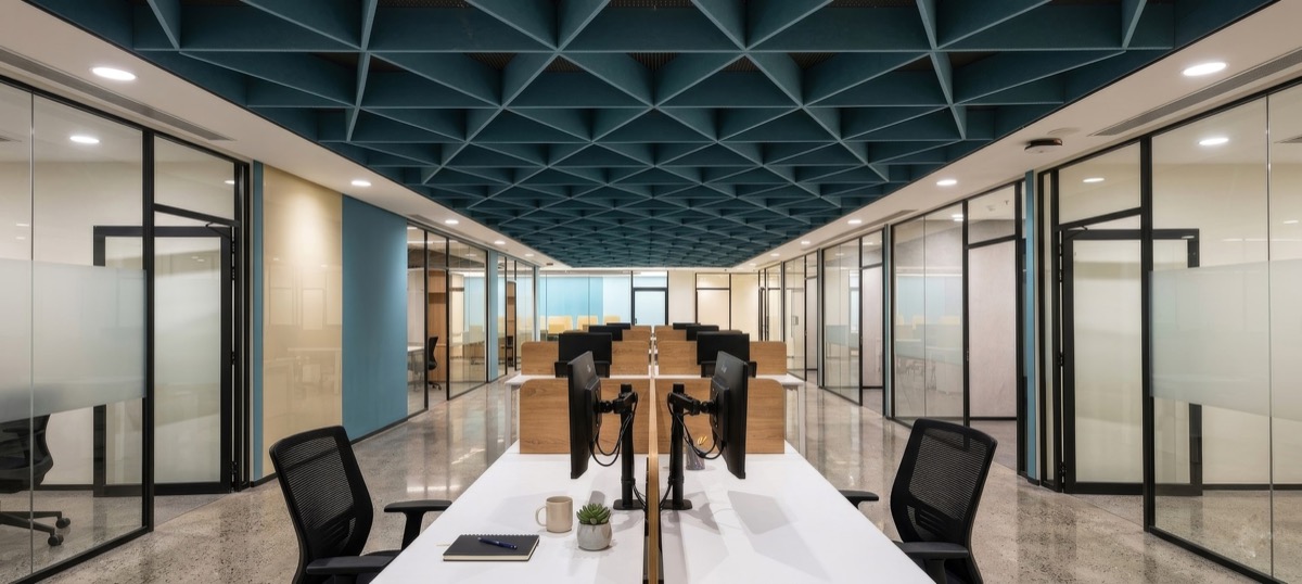 Workspace with faceted teal ceiling
